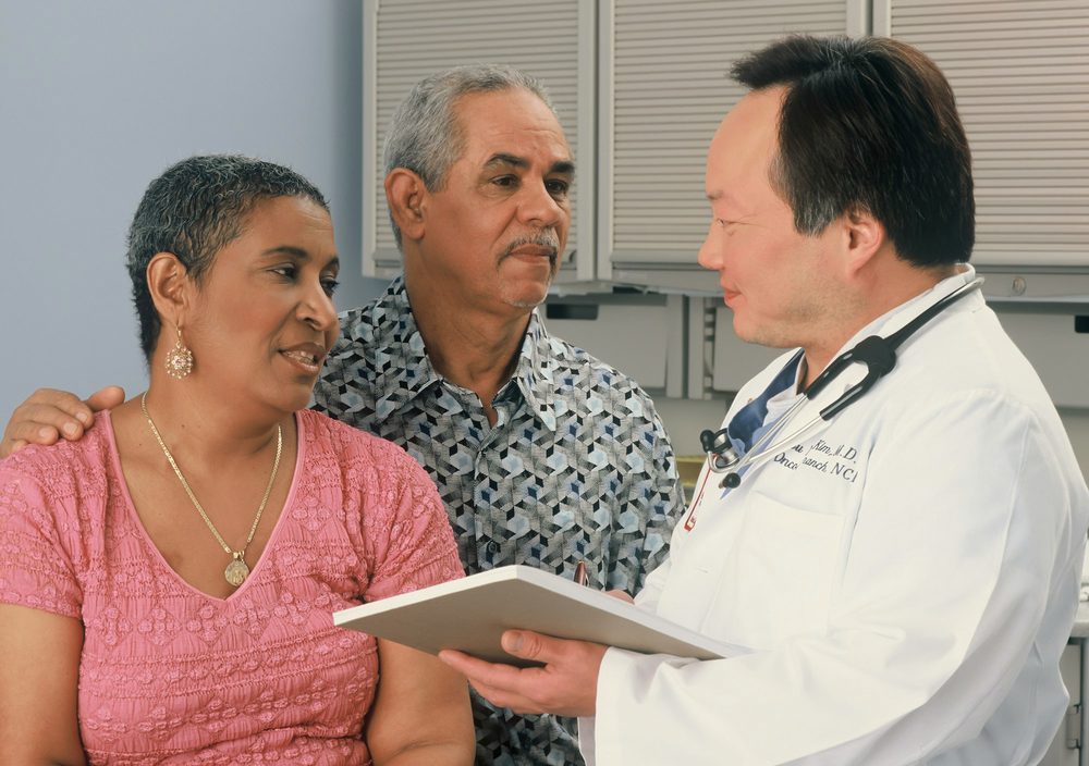 A physician talking a couple through their results