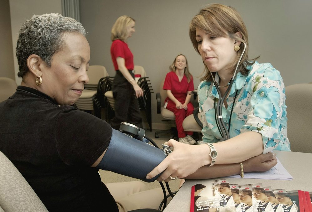 A blood pressure check during a screening visit